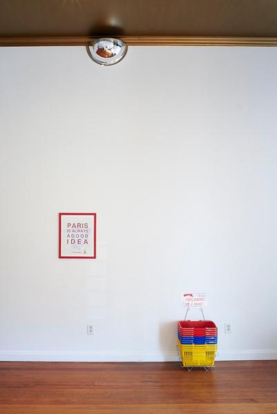 Jessica and Savannah grab dog toys for weapons as they stare at the front door., shopping baskets, 2015