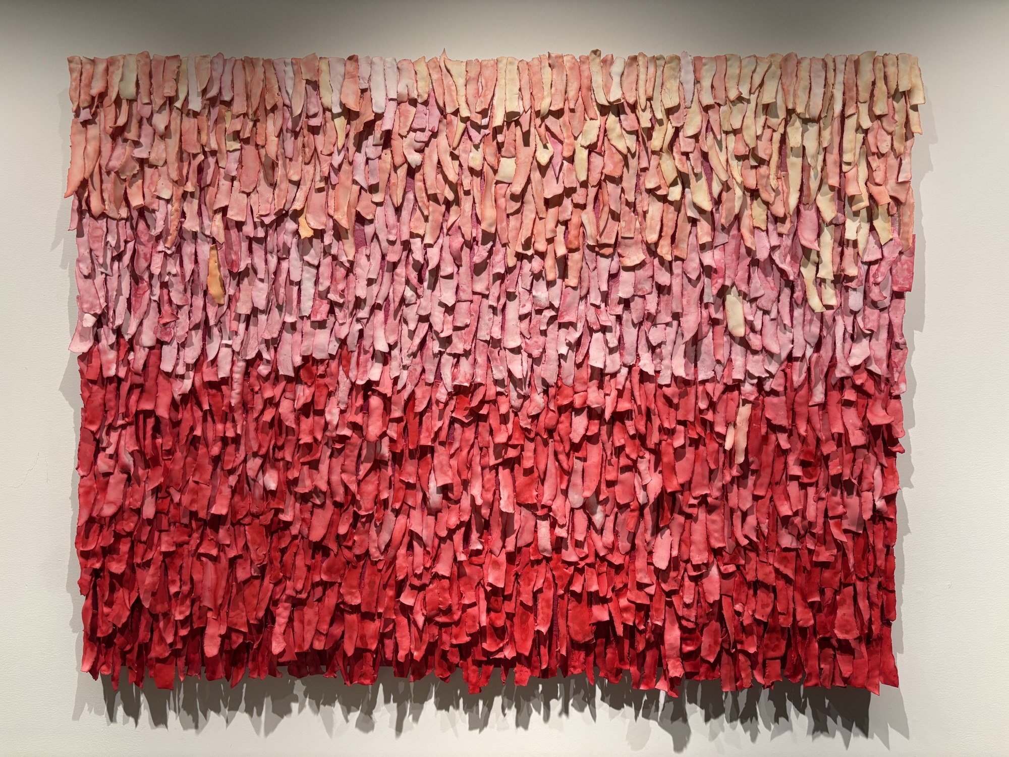 ReCheng Tsang, Frayed : Red, Porcelain, acrylic wash, stainless steel dressmaking pins mounted on industrial felt, 36