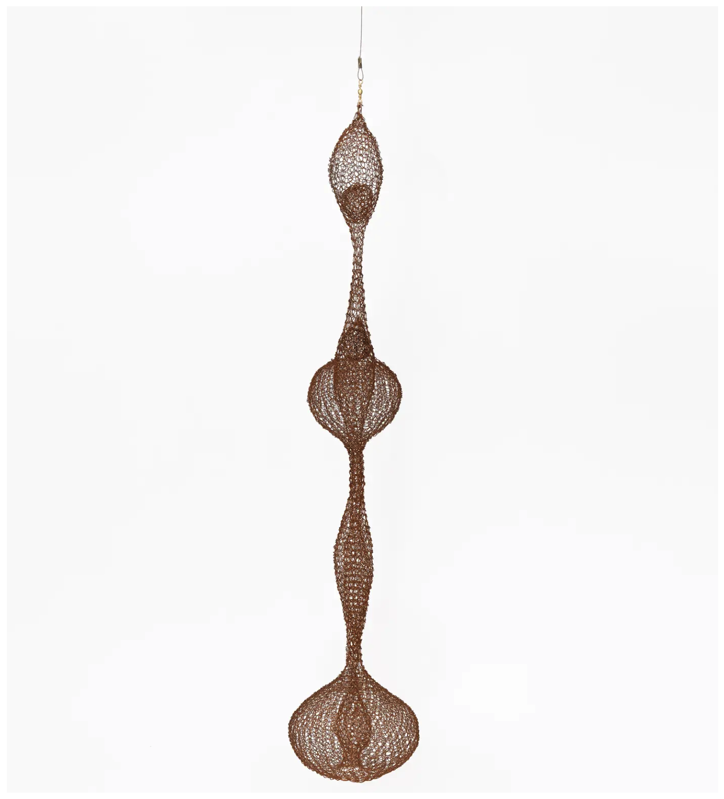 Untitled (S.783, Hanging Miniature Five-Lobed, Interlocking Continuous Form within a Form with Interior Spheres), c. 1968 copper wire Artwork © 2026 Ruth Asawa Lanier, Inc., Courtesy David Zwirner