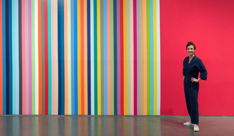 Leah Rosenberg with her work Getting Better Everyday a Color (2021) at SFMOMA. Photo by Don Ross.