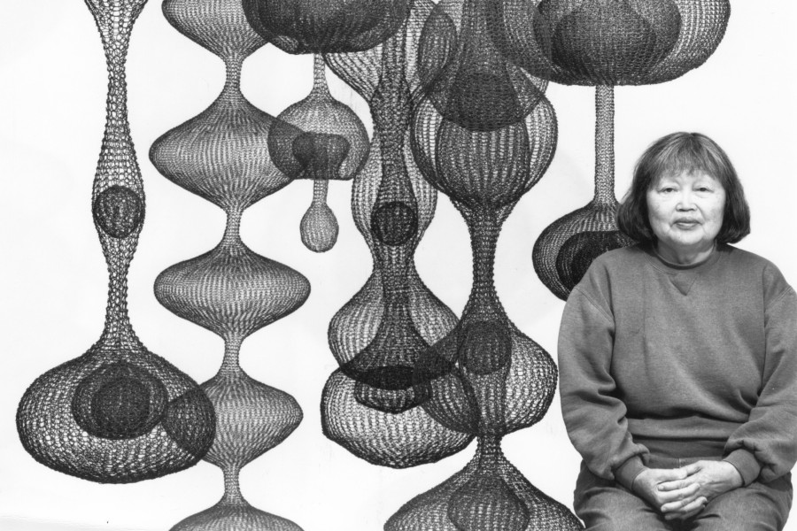 Ruth Asawa pictured with her most recognizable works, looped-wire hanging sculptures. (Courtesy of RAL, Inc.)